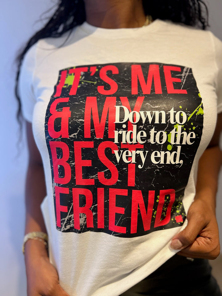 Close-up of a woman wearing the "Down to Ride" T-shirt by Dass My Best Friend, showcasing the bold front design. The feminine-fitted tee highlights the playful and adventurous spirit of best friends.